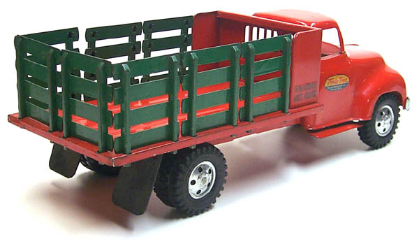 rear view of a 1955 Tonka Lumber Stake Truck Number 0860-5 with racks